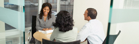 three people meeting in an office